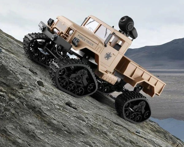 Khaki camera truck angled on an incline