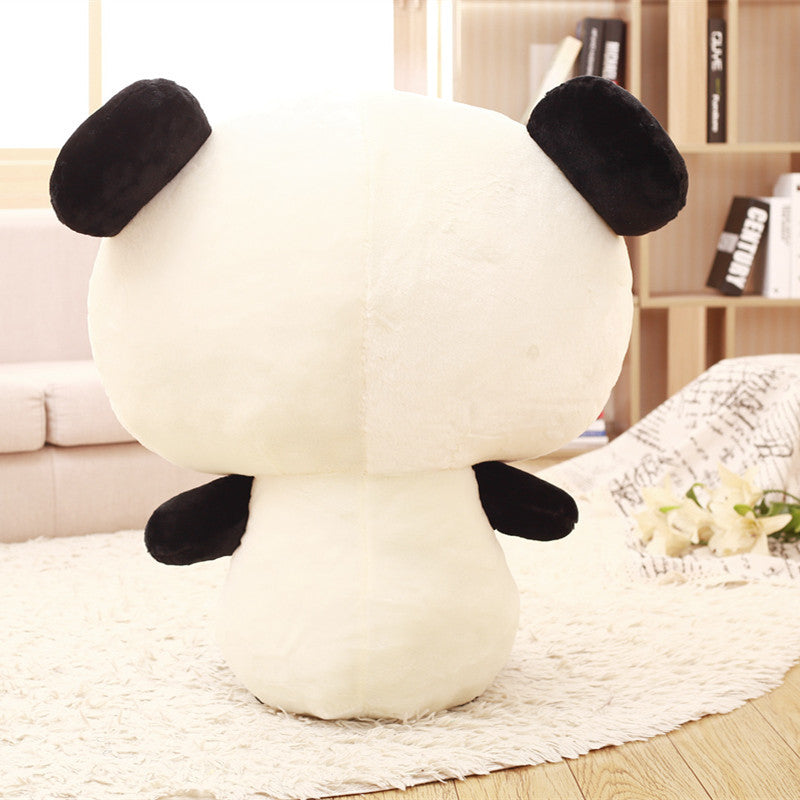 Close-up of the giant panda plush face with big sparkling eyes