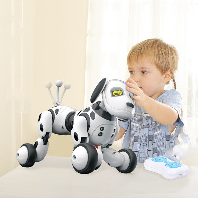 Child beside a spotted robot dog and remote