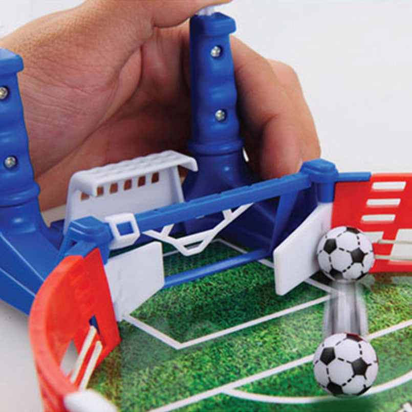 Close-up of the mini football pitch with goals and player handles