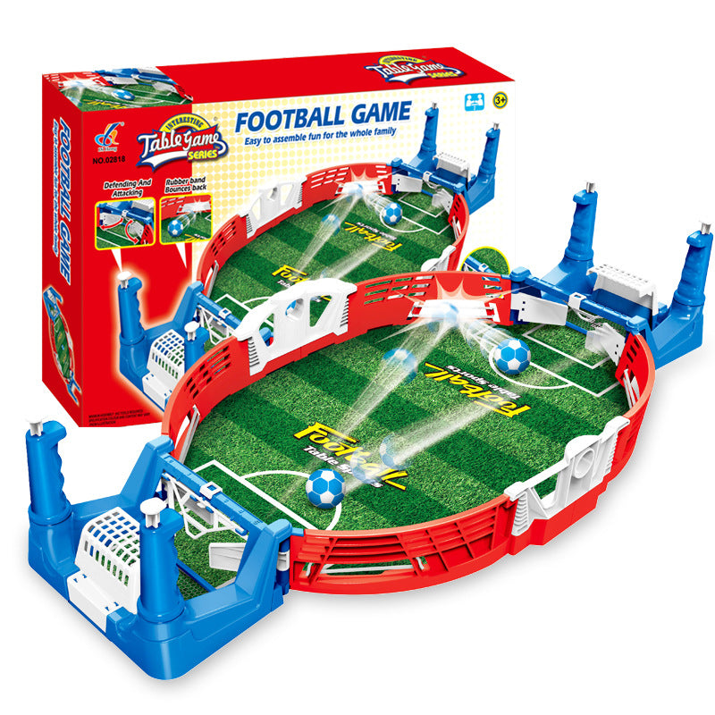 Tabletop mini football game with a green pitch and red and blue goals beside its box