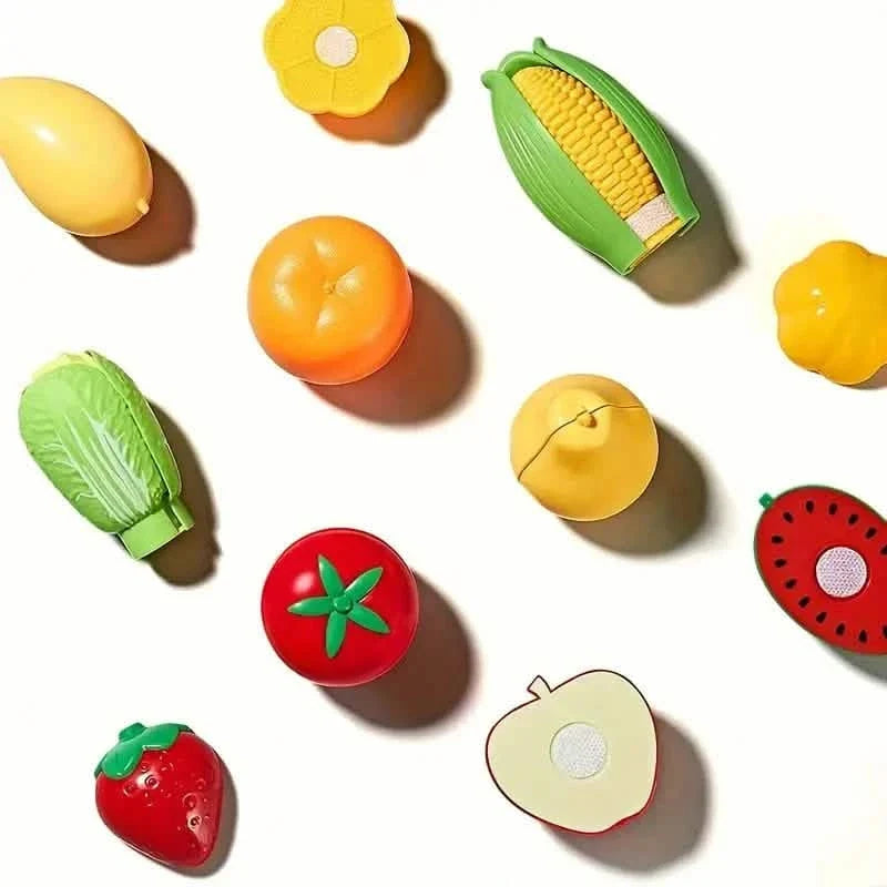 Close-up view of the play food cutting set with fruits and vegetables