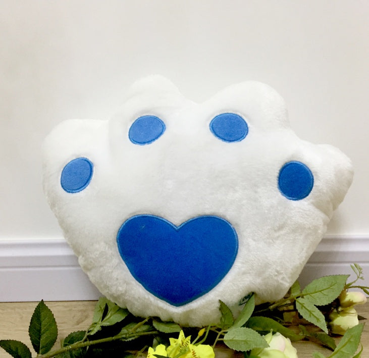 Close-up view of the glowing star shaped LED pillow
