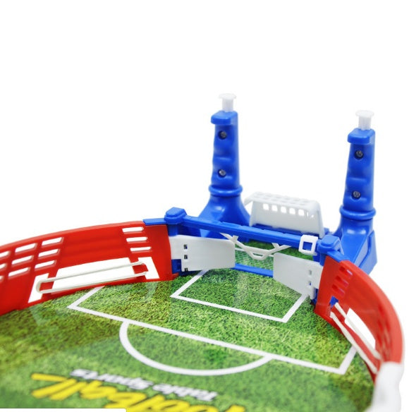 Hands playing the tabletop mini football game with flick handles