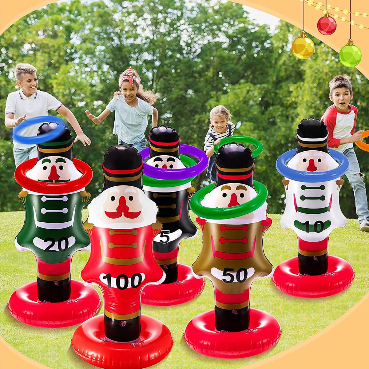 Kids playing the inflatable nutcracker ring toss game outdoors.