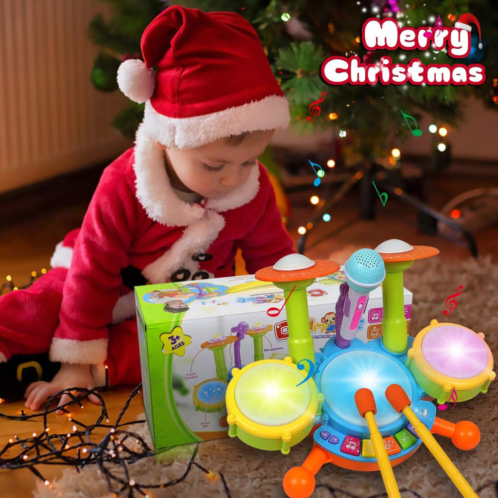 Child beside the boxed toy drum kit