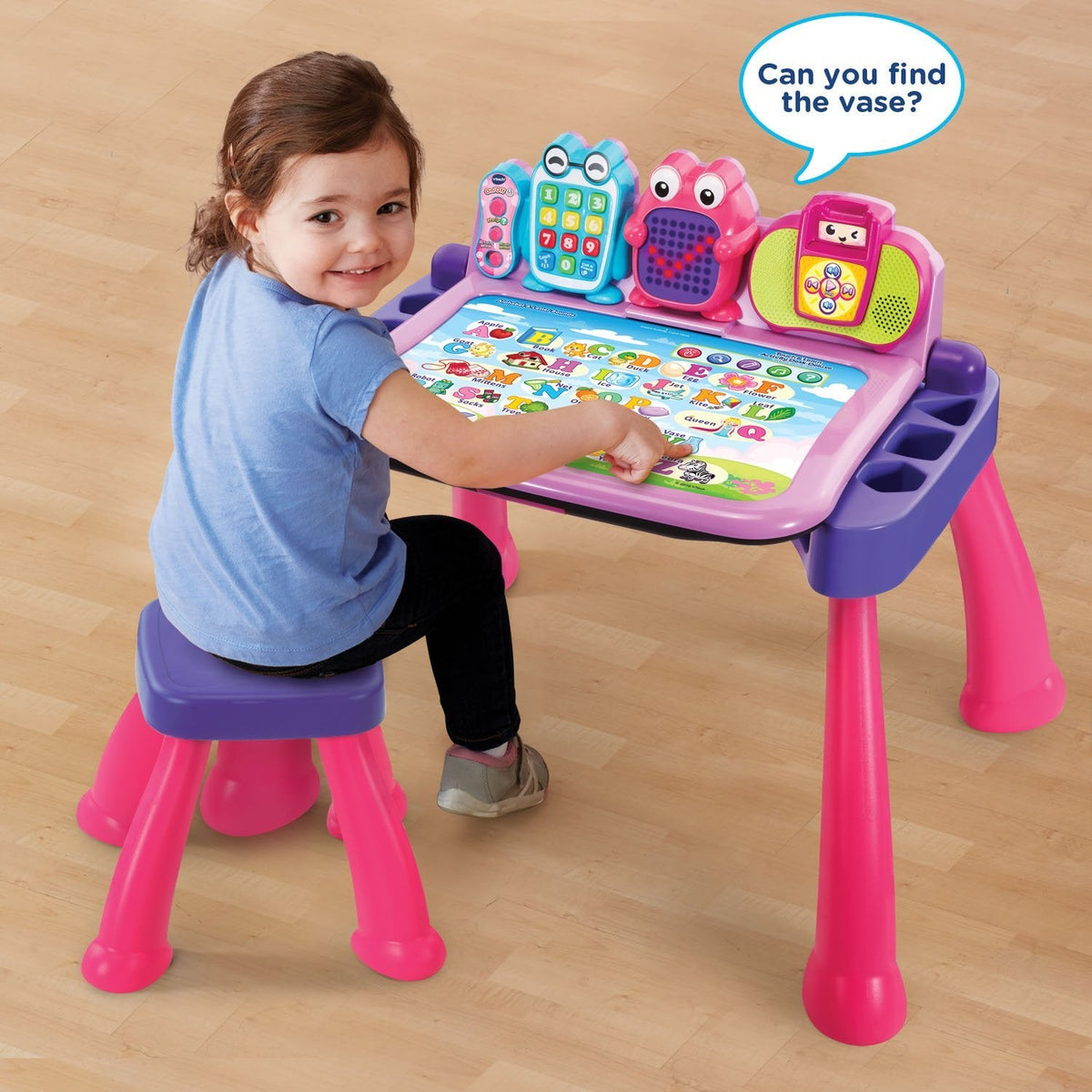 Child seated at the Touch & Learn Activity Desk