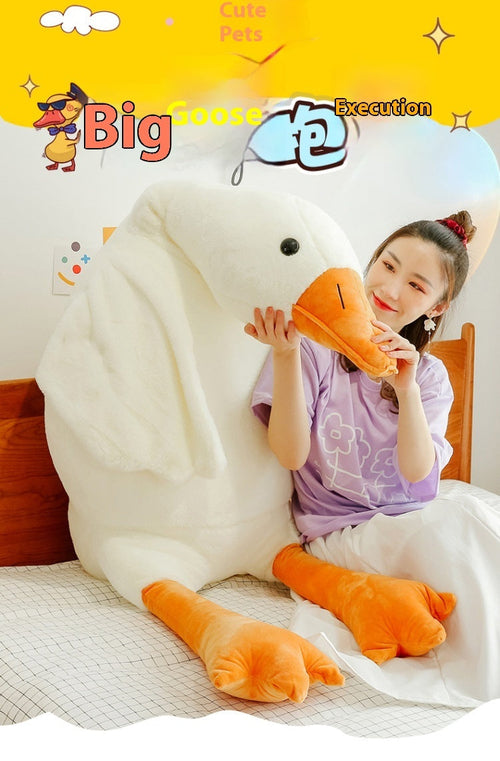 Person hugging a large white goose plush pillow