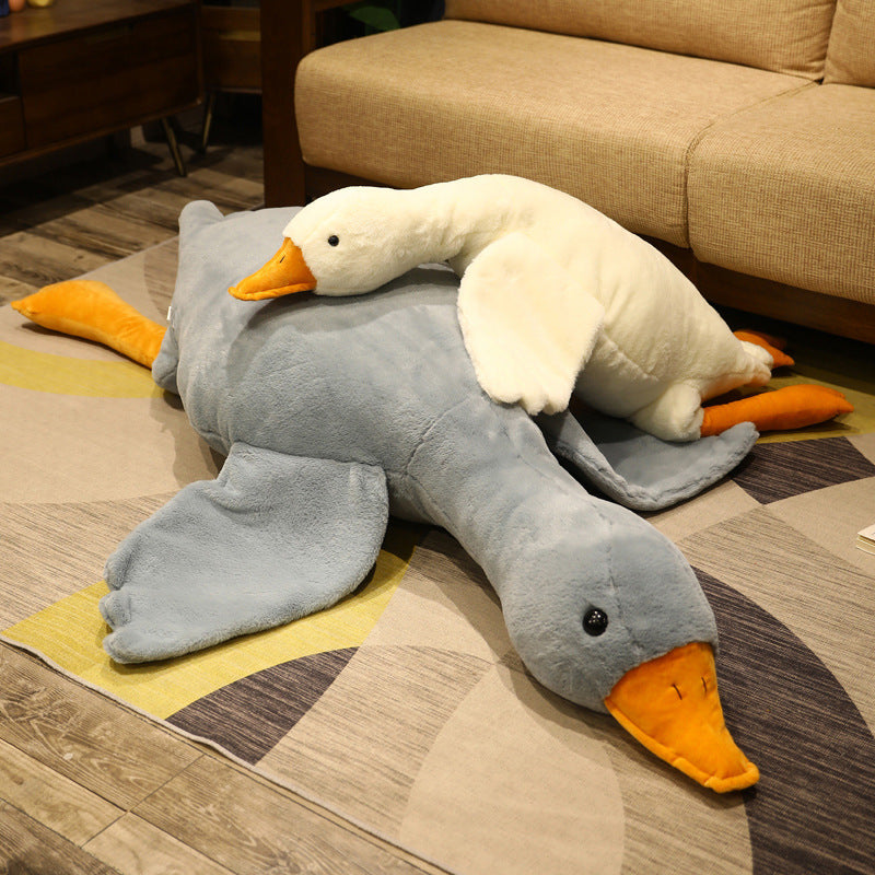 The giant goose plush pillow in playful arrangement