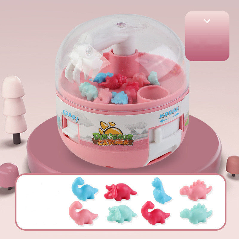 mini dinosaur claw machine arcade game arranged for display