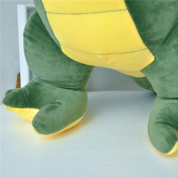 dinosaur plush with reversible sequins arranged for display