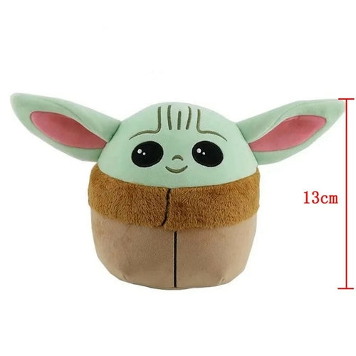 Green-eared plush beside a 13 cm height marker