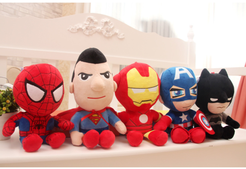 Group of plush superhero characters seated on a shelf