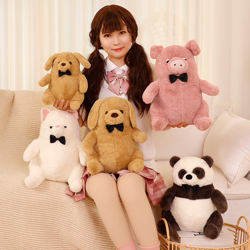 Five soft plush animal toys wearing bow ties held on a couch