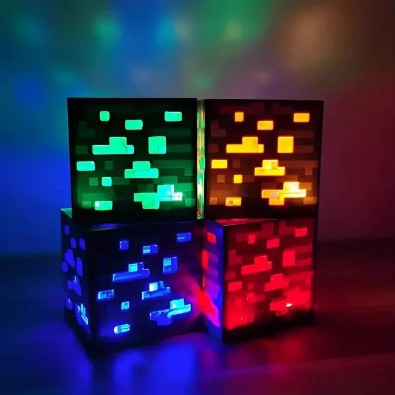 Four glowing pixel ore block night lights in green, orange, blue, and red stacked together.