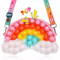 Rainbow pop-it shoulder bag shaped like a rainbow over clouds with a patterned strap.