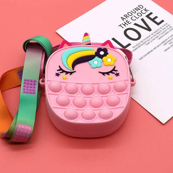 The unicorn pop-it crossbody purse in playful arrangement